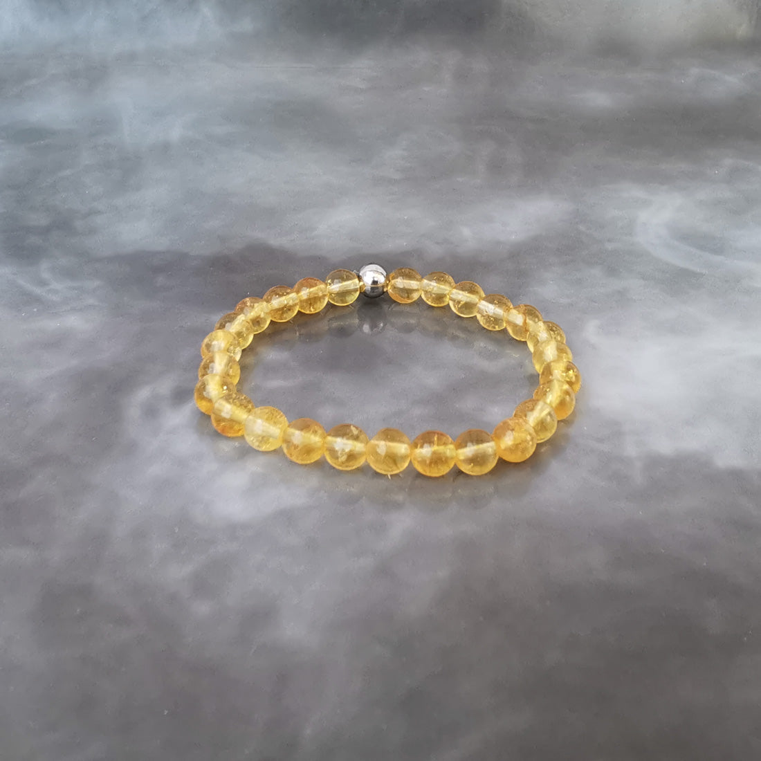 Bracelet élastique de lithothérapie. La Citrine est une pierre de réconfort. "Pierre de l'argent" apportant abondance et prospérité. Aide à prendre des décisions et/ou un nouveau départ.*