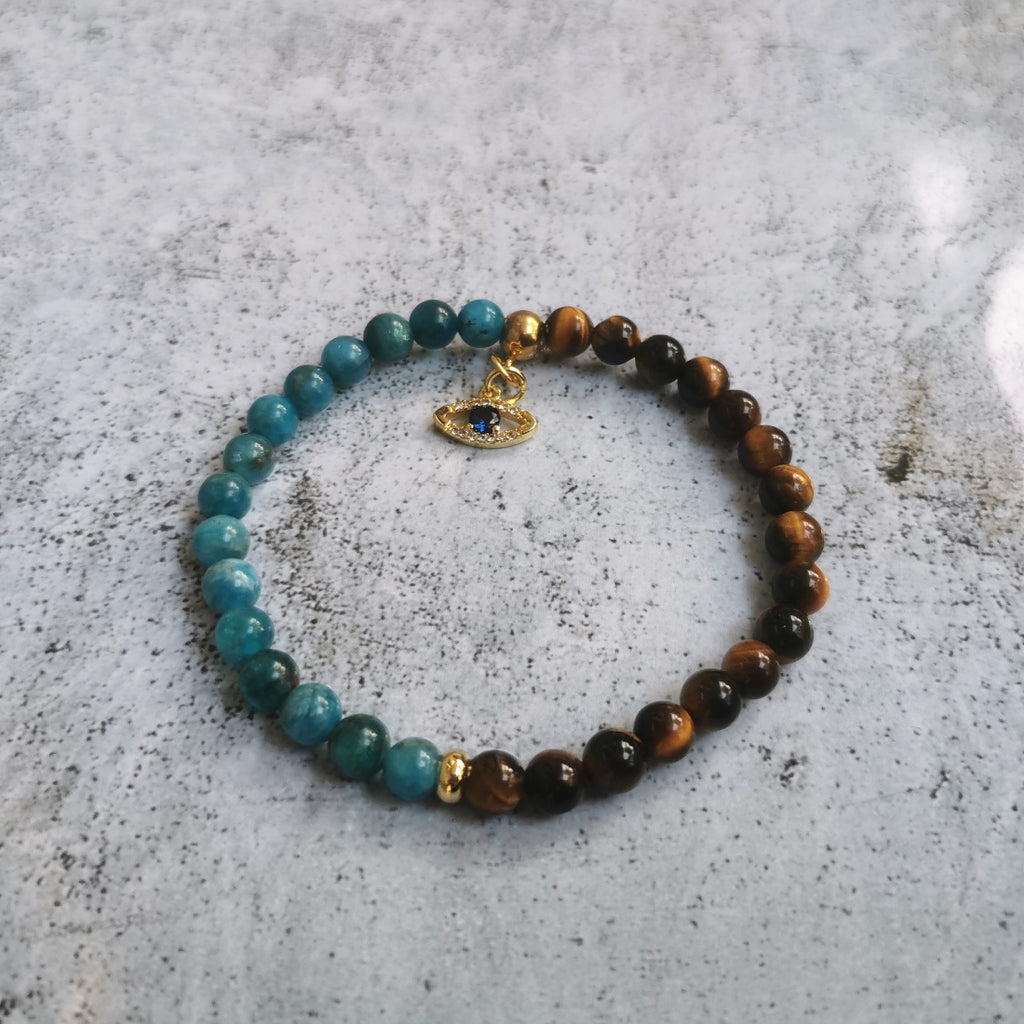 Bijou bracelet en pierres fines, œil de tigre, apatite. breloque  "œil de protection" en zircon cubique et acier inoxydable. Haut de gamme fantaisie créateur bijoux